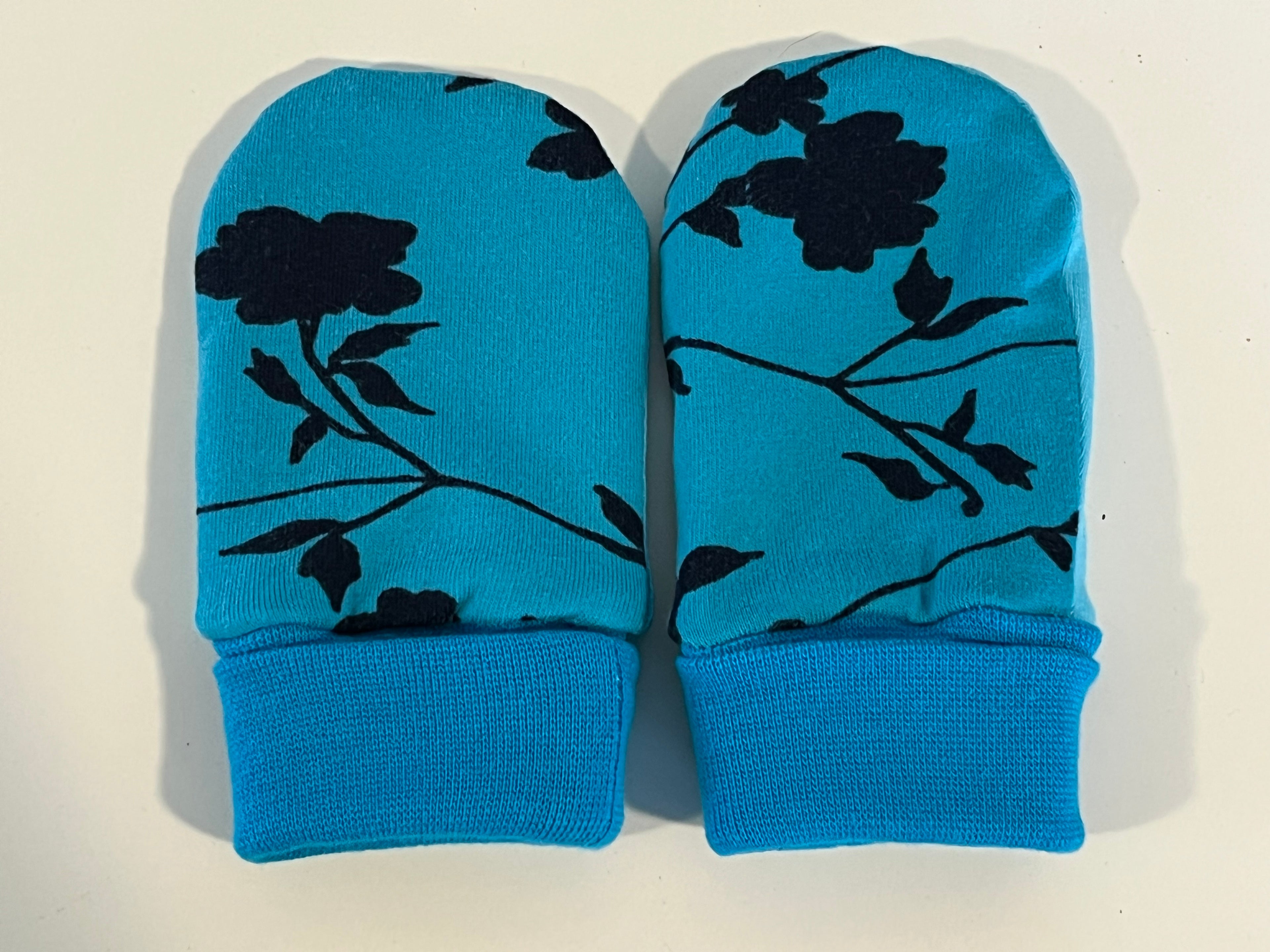 Babyvotter, blå med blomster