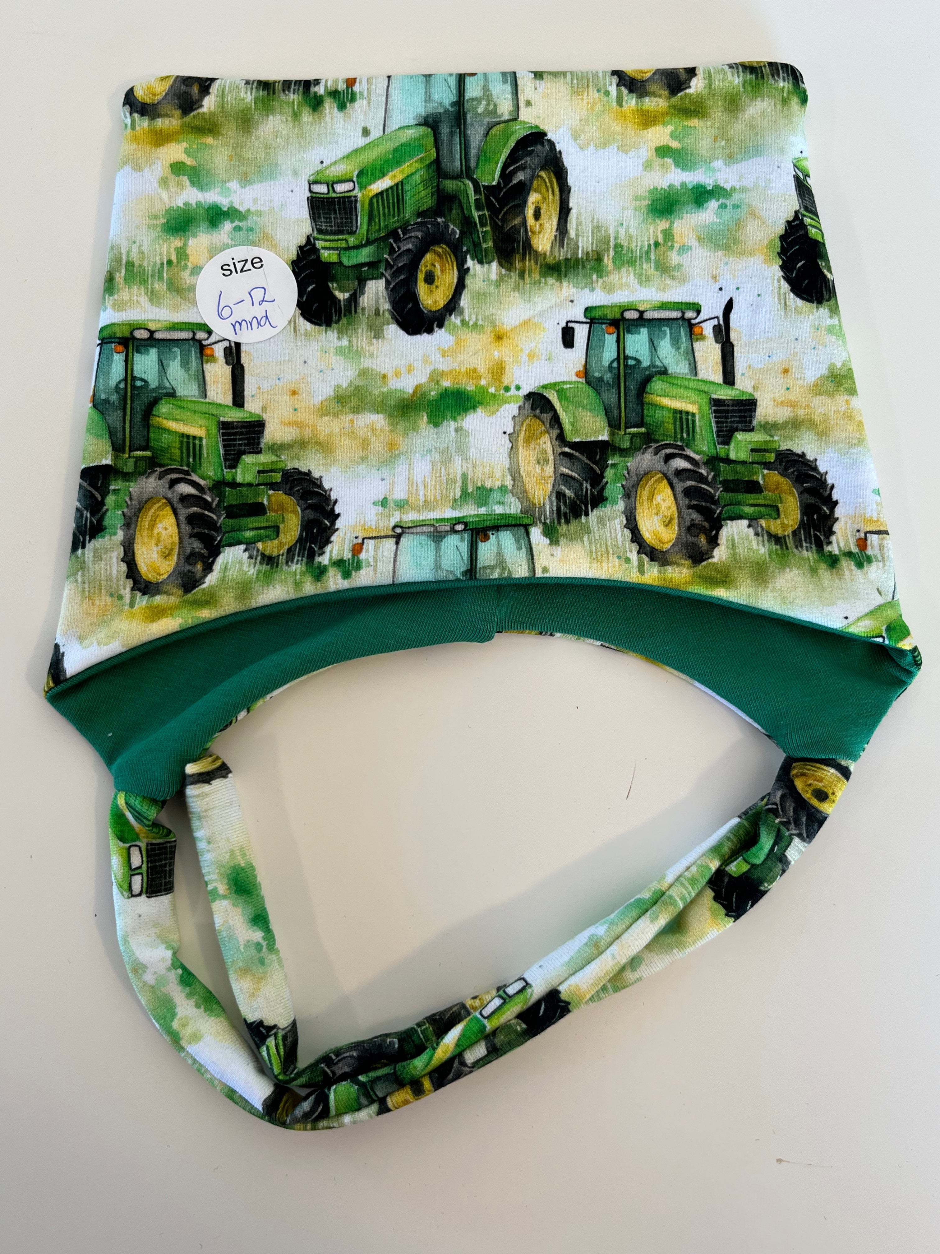 Knytelue, grønn traktor